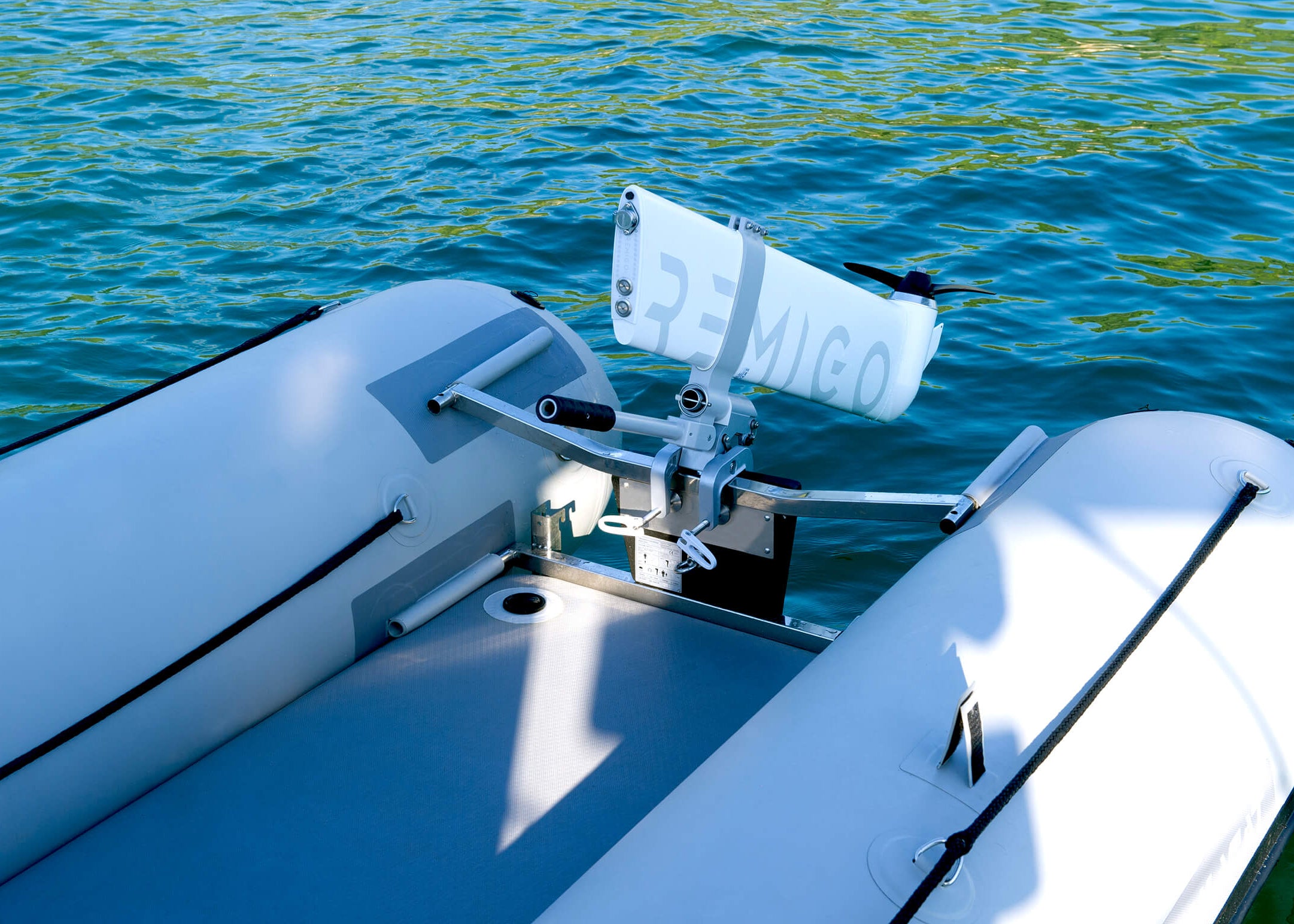 Inflatable boat with an electric motor Remigo on a body of water