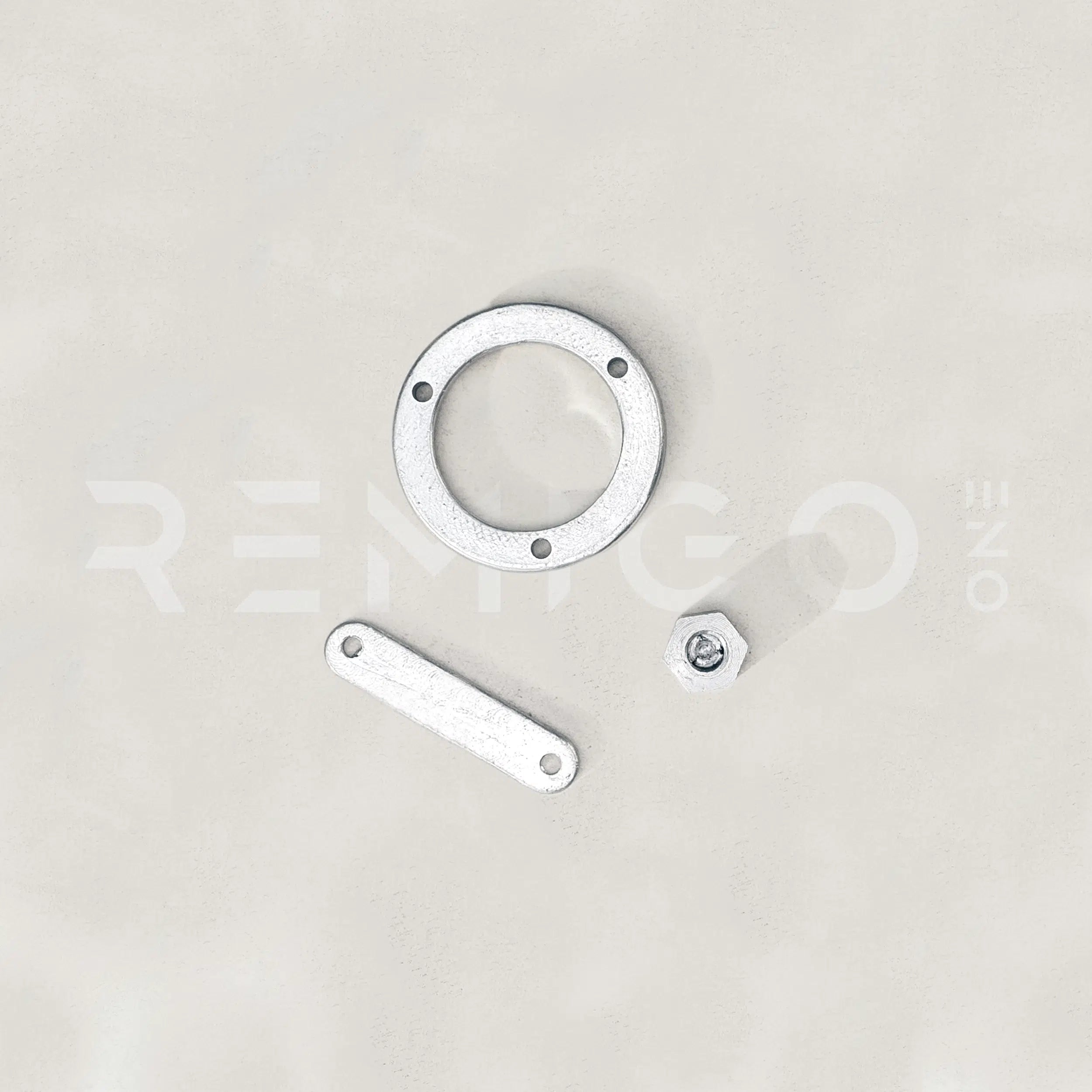 Metallic hardware components on a light gray background