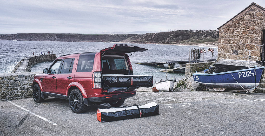 MiniCat inflatable sailboat packed into compact bags fitting in a car boot or campervan