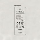 Remigo DC charger with certification logos on a light gray background