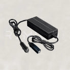 Black power adapter with cable on a light gray background