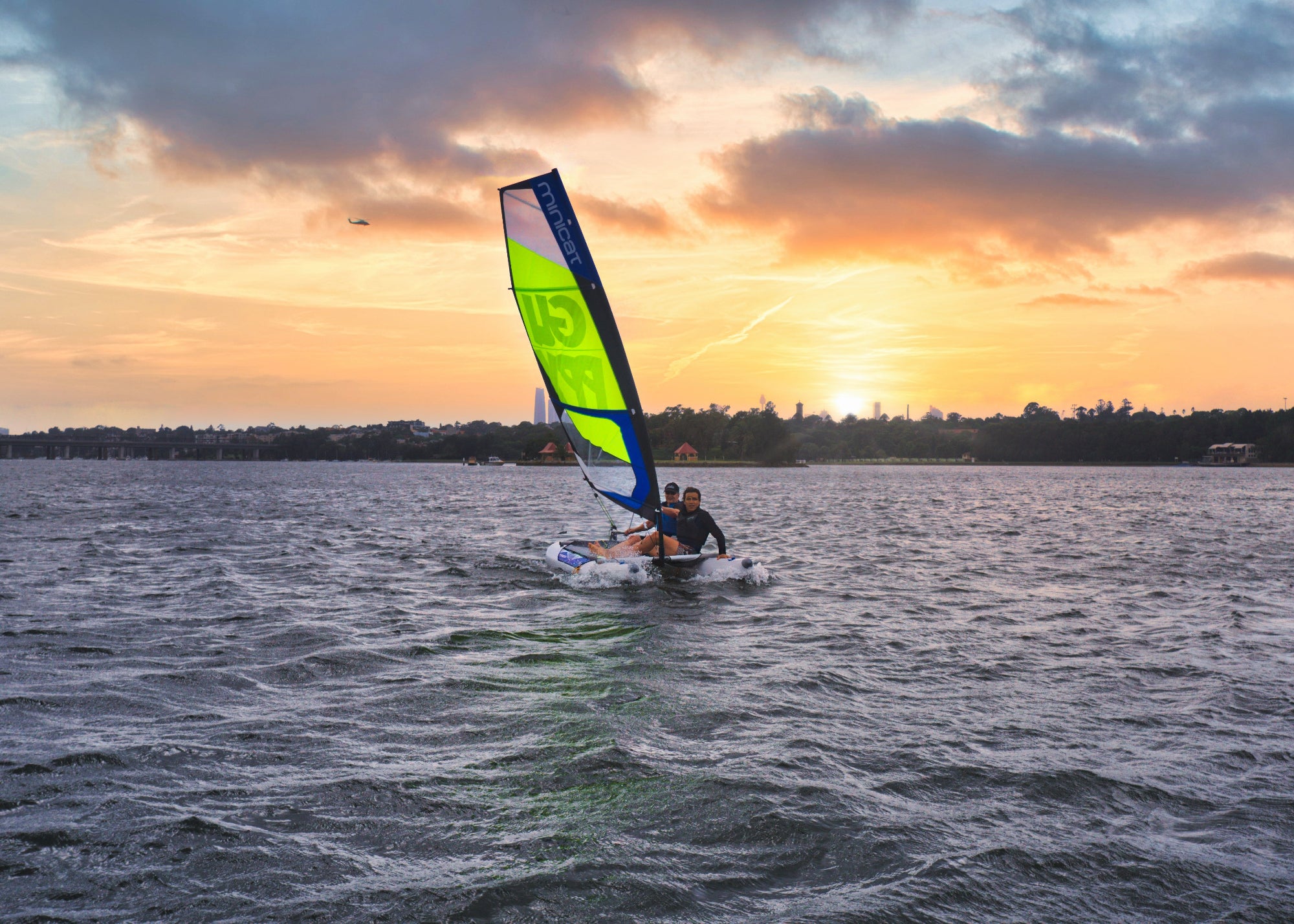 Sailboat dinghy MiniCat Guppy sailing in  Sydney bay
