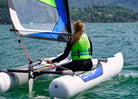 MiniCat Guppy sailboat sailing at the lake Como in Italy 