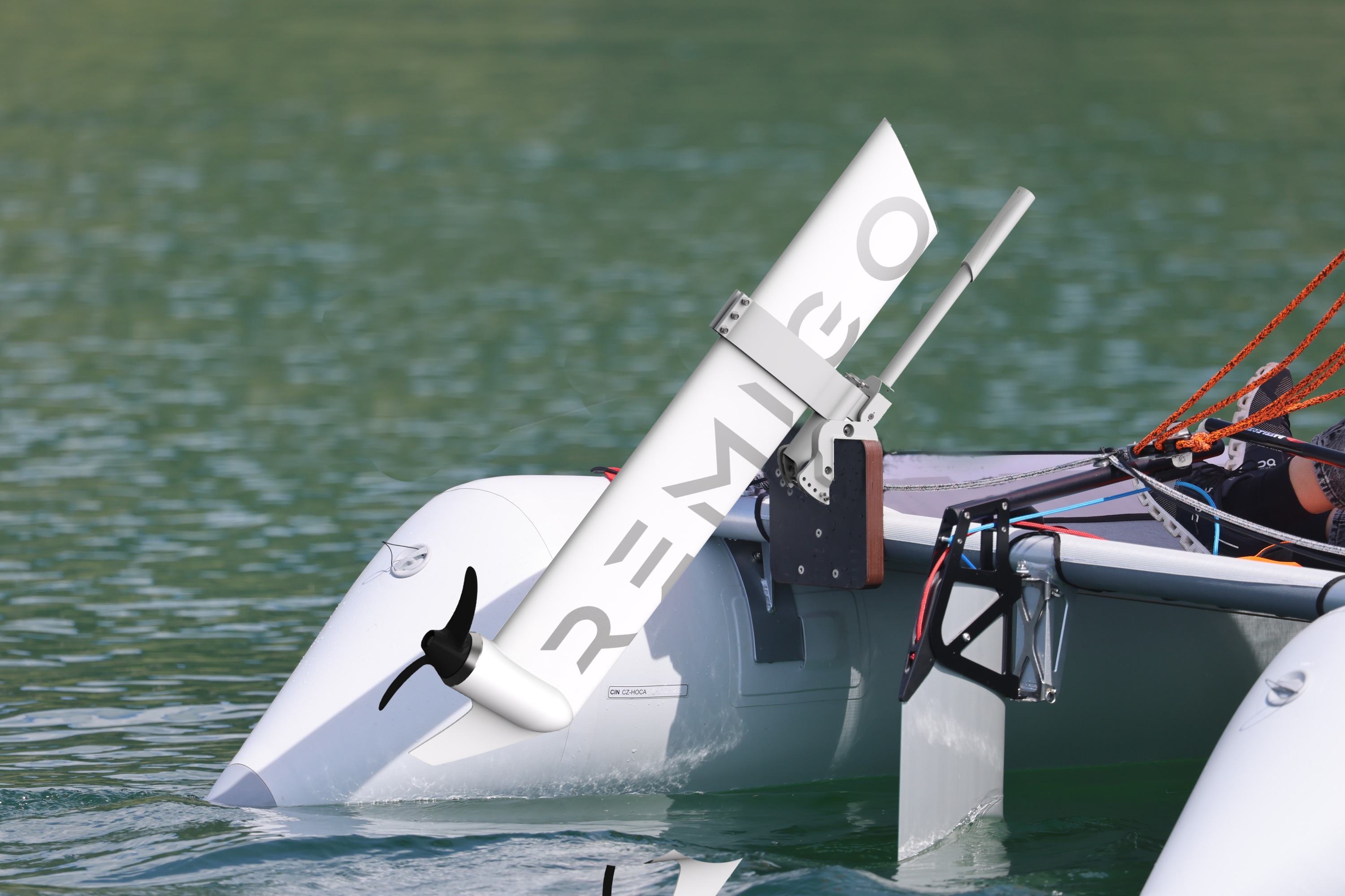 MiniCat sailing boat with Remigo electric outboard attached to the engine support 