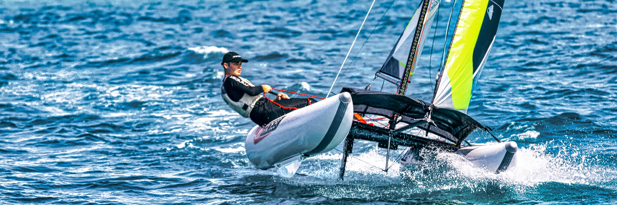 Person sailing on a small boat MiniCat in the ocean